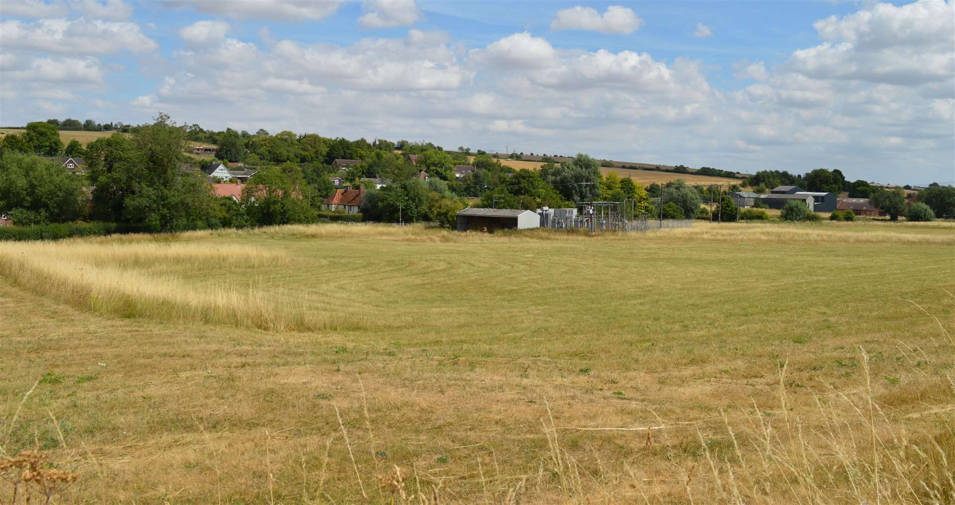 A view of where the hamlet once stood — today a field and electricity substation