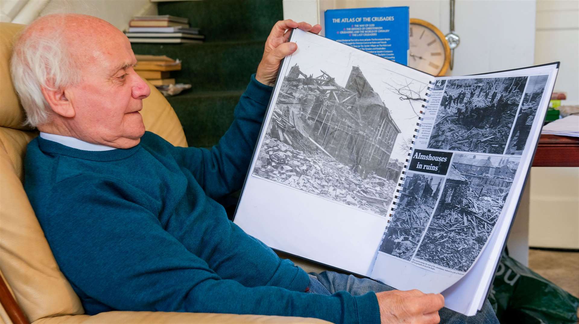Newbury man, Allan Mercado, with his scrapbook of wartime press cuttings from the Newbury Weekly News