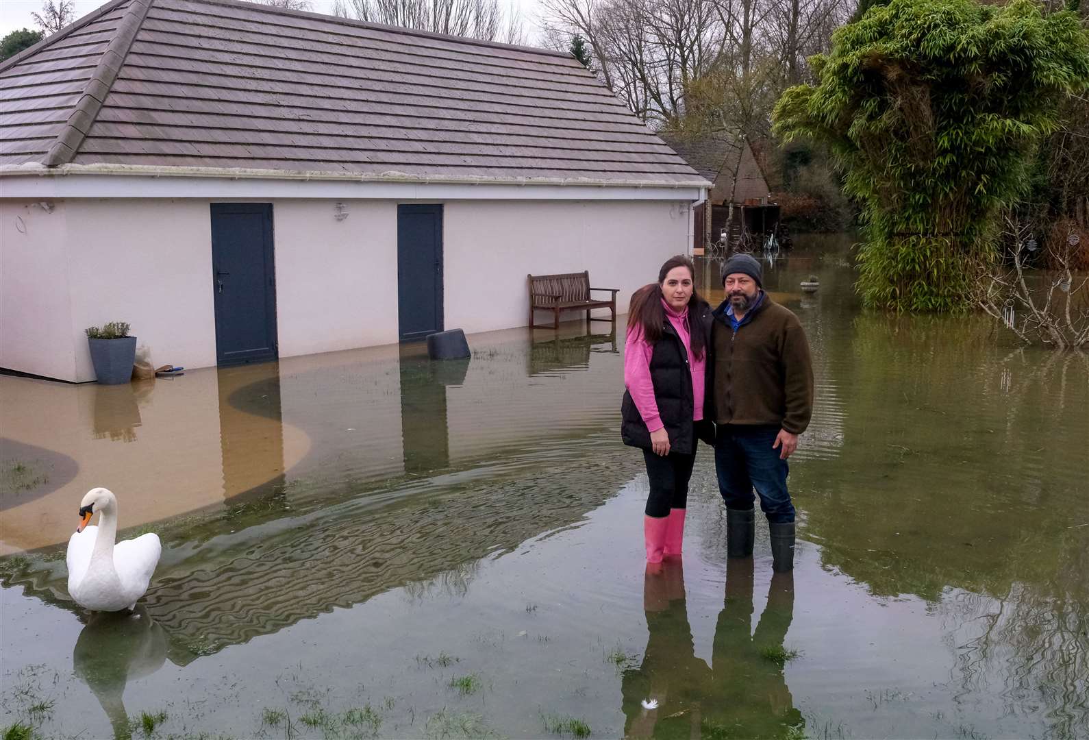 Reem and Sami Gabriel in their flooded garden