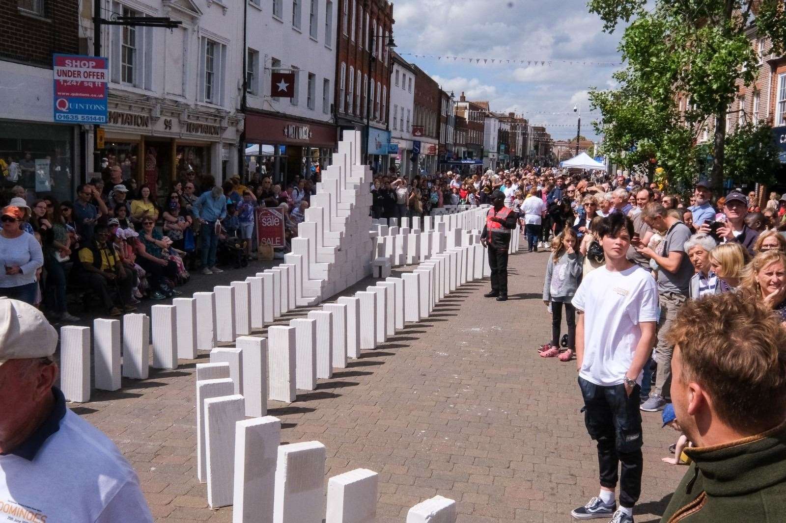 The dominoes lined up and ready to fall through the town centre