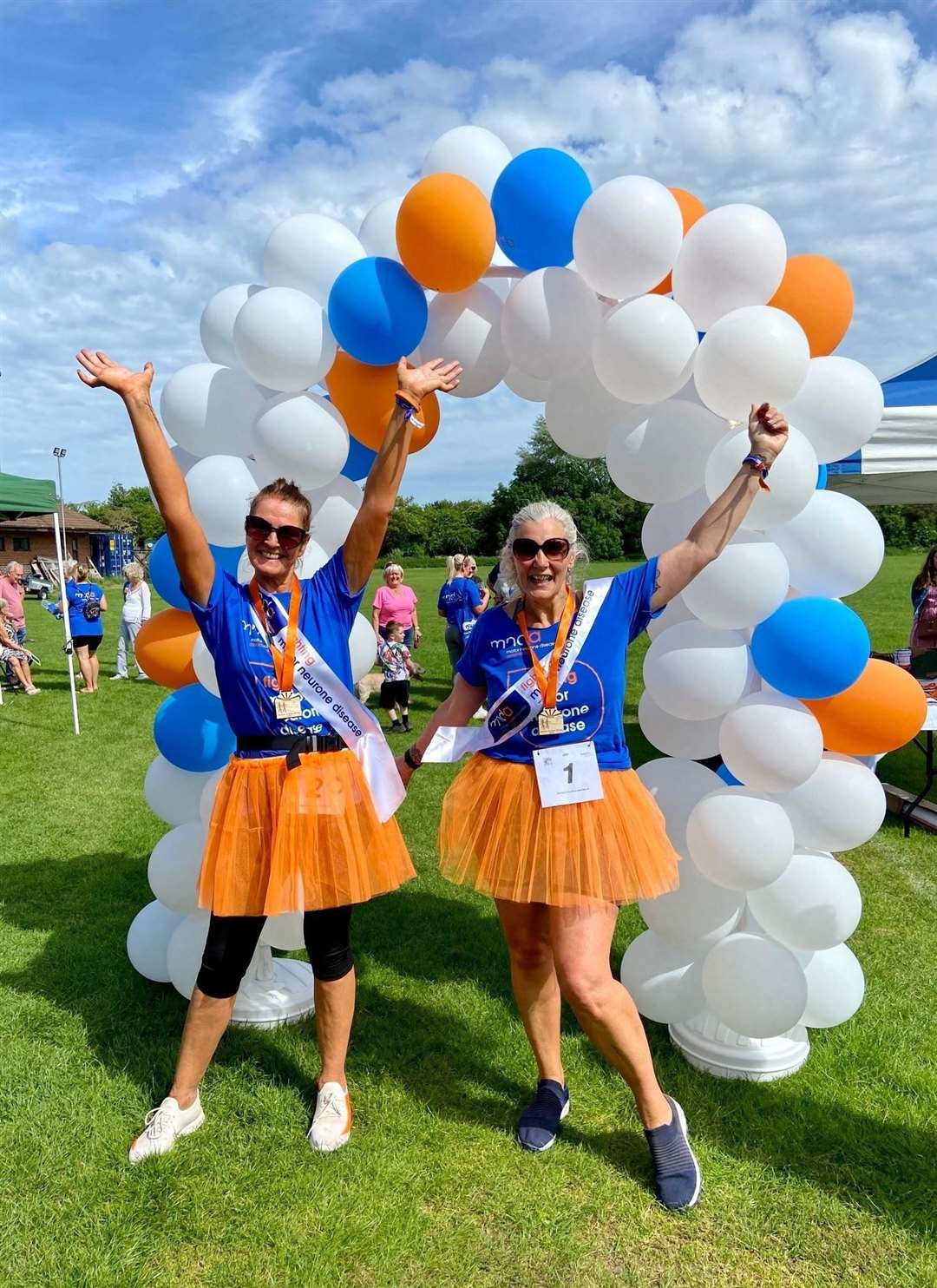 Fundraiser organisers Trudy Churcher (left) and Dee Gunning at the finish line at Thatcham Town FC's Waterside Park