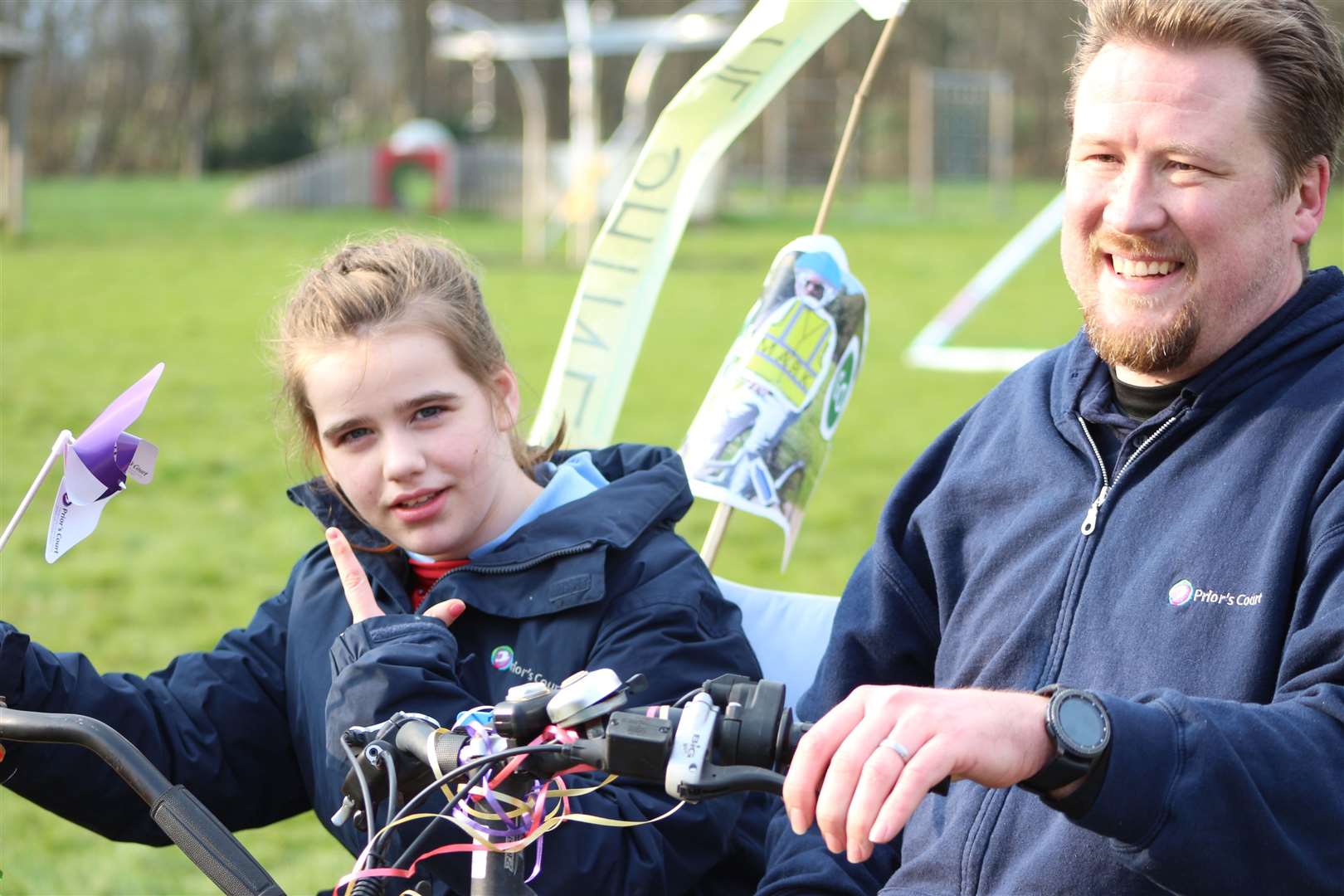 Mark on the tricycle with Prior's Court youngster, Helena