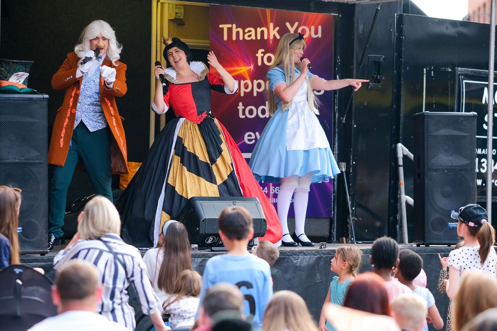 Alice and Queen of Hearts entertain the crowds