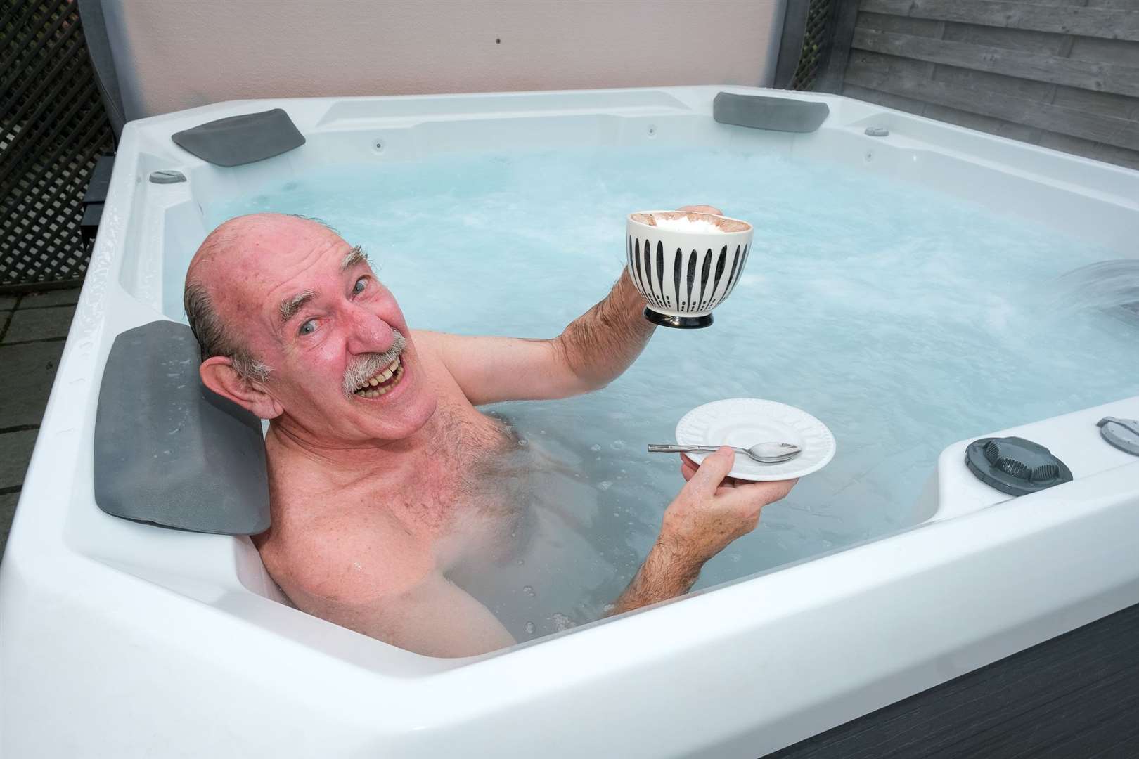Nicholas Lumley enjoying a hot chocolate in one of the spa's hot tubs