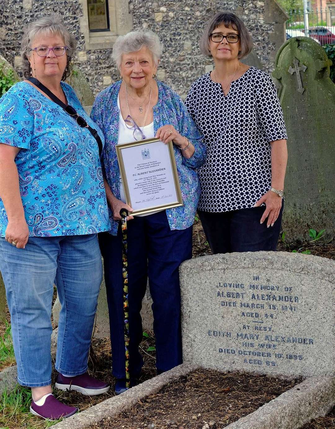 Linda Willason, Sheila LeBlanc and Karen LeBlanc by the family grave