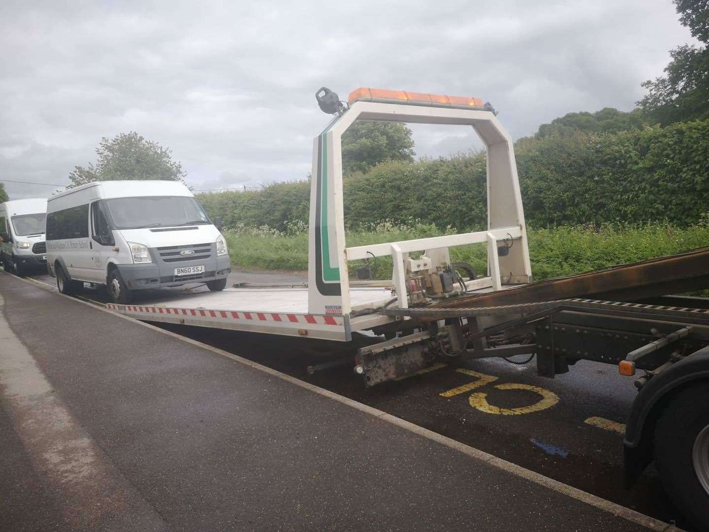The vandalised minibus being taken away to be repaired yesterday (May 25)