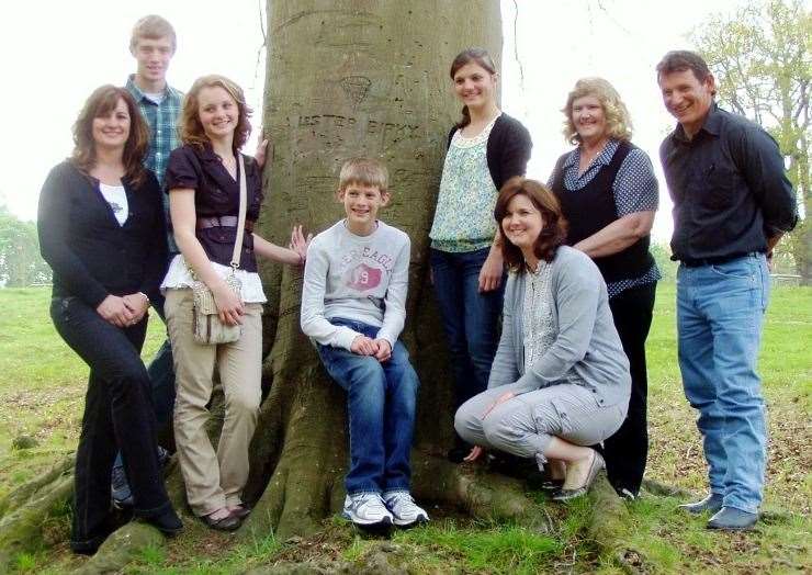 The Birky family by the tree where their ancestor left his mark. Dated 2011. Credit: Michael Dowdeswell