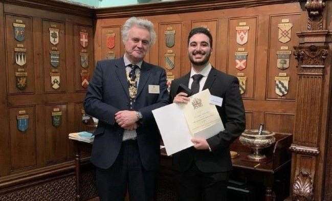 Chris Miltiadou receiving his award from Dr Bowdler
