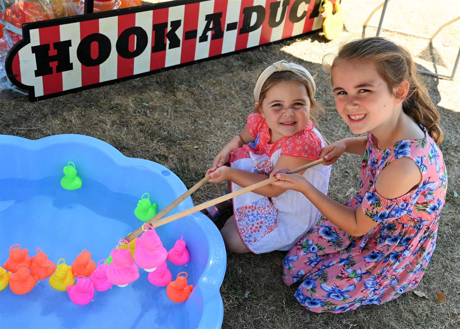 Madelyn (4) & Sophia Perry (8) playing hook-a-duck