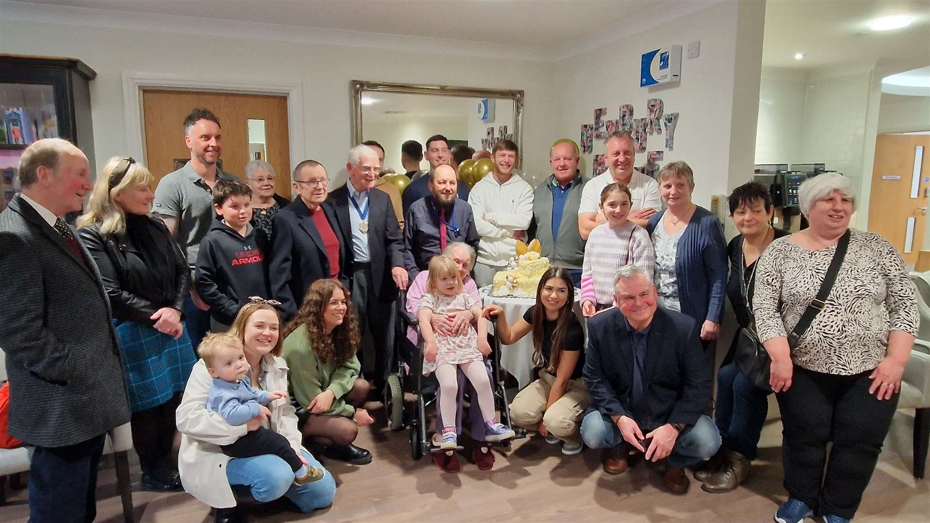 Phyllis celebrating her milestone birthday with her family and Deputy Mayor of Newbury, Andrew Moore