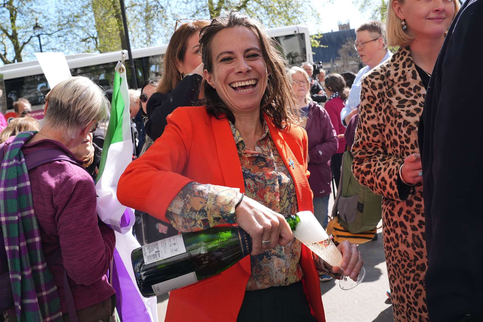Campaigners celebrating outside the Supreme Court after the ruling (Lucy North/PA)