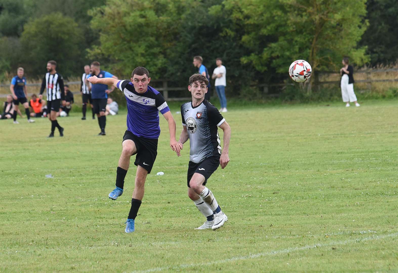 Two players have eyes on the loose ball