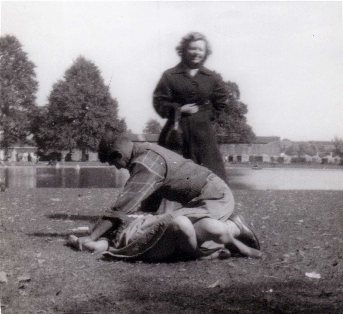 Getting to know the locals in Victoria Park, Newbury in July 1952. Note the anti-tank obstacles leftover from the war in the background