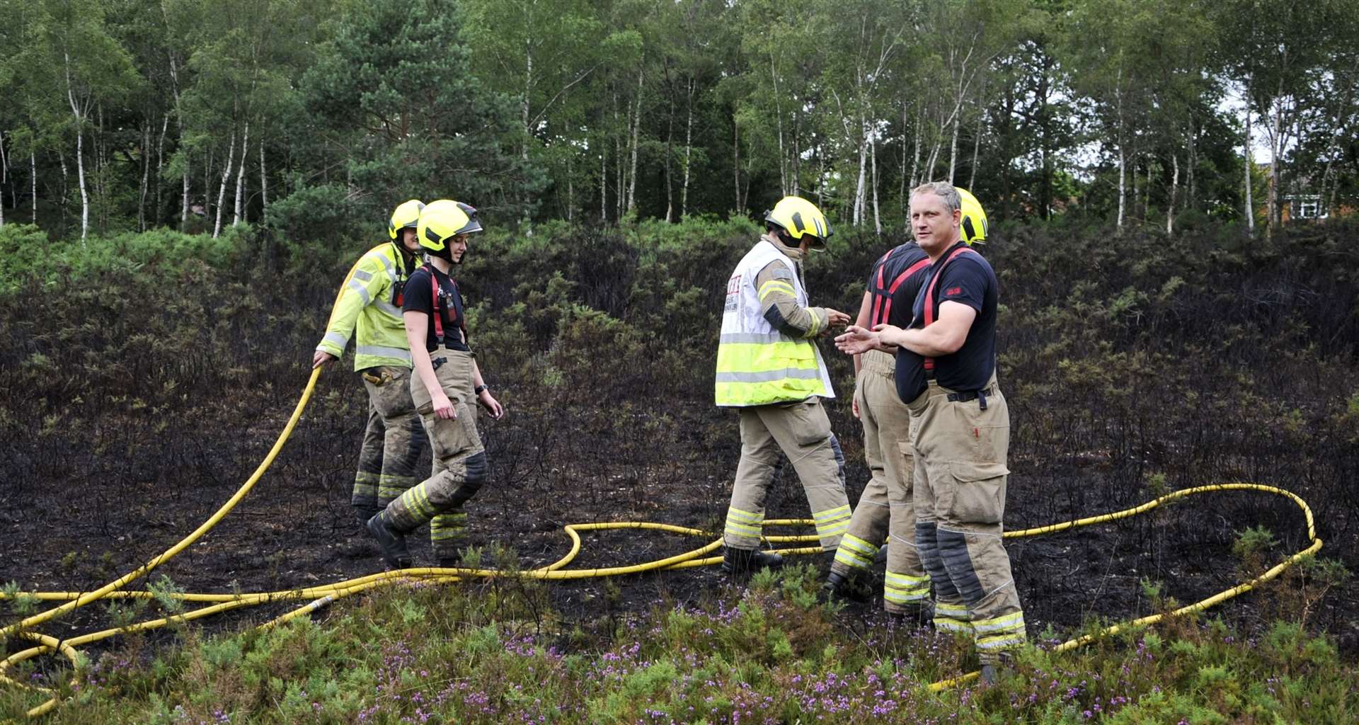 Firefighters stop the fire from spreading. Credit: Paul King