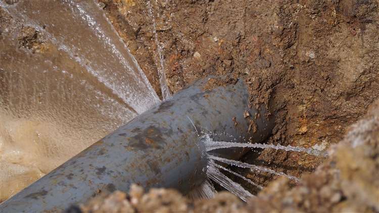 Burst water pipe. Stock image