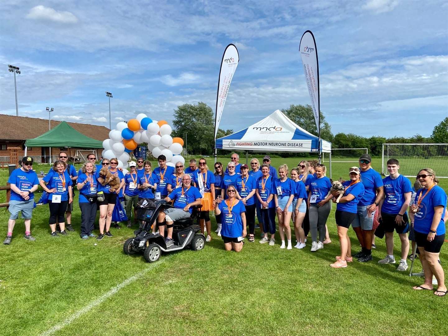 All those who took part in the fundraiser walk at the finish line at Thatcham Town FC's Waterside Park