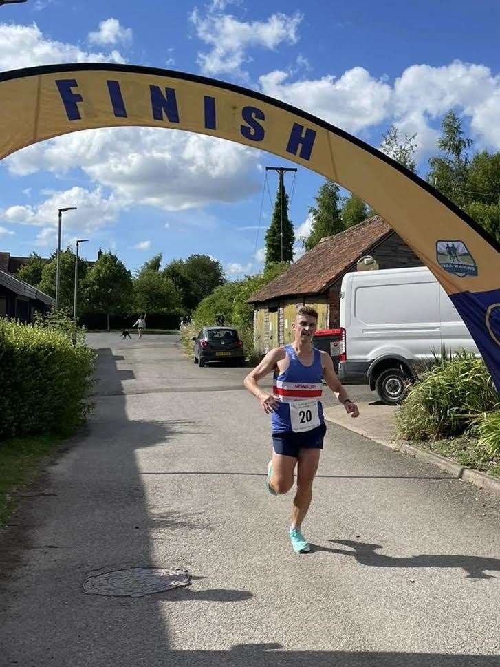 Callum O'Neill crosses the finish line