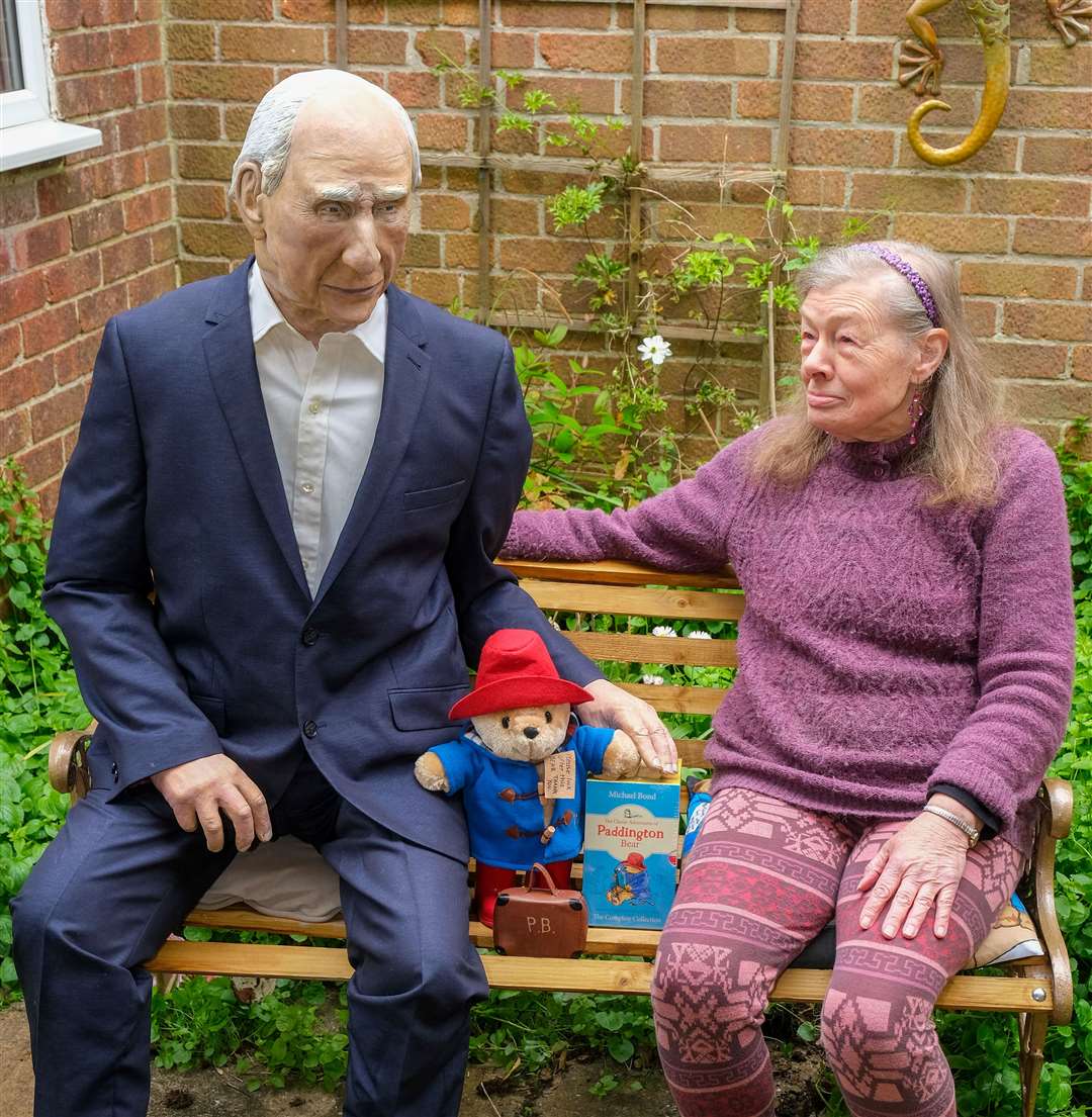 Mrs Oppel sitting in her garden with her latest creation