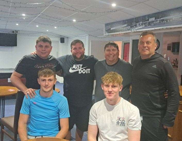 Hungerford Town manager Danny Robinson (centre left) with new U23 recruits (front) and the side's new coaches.