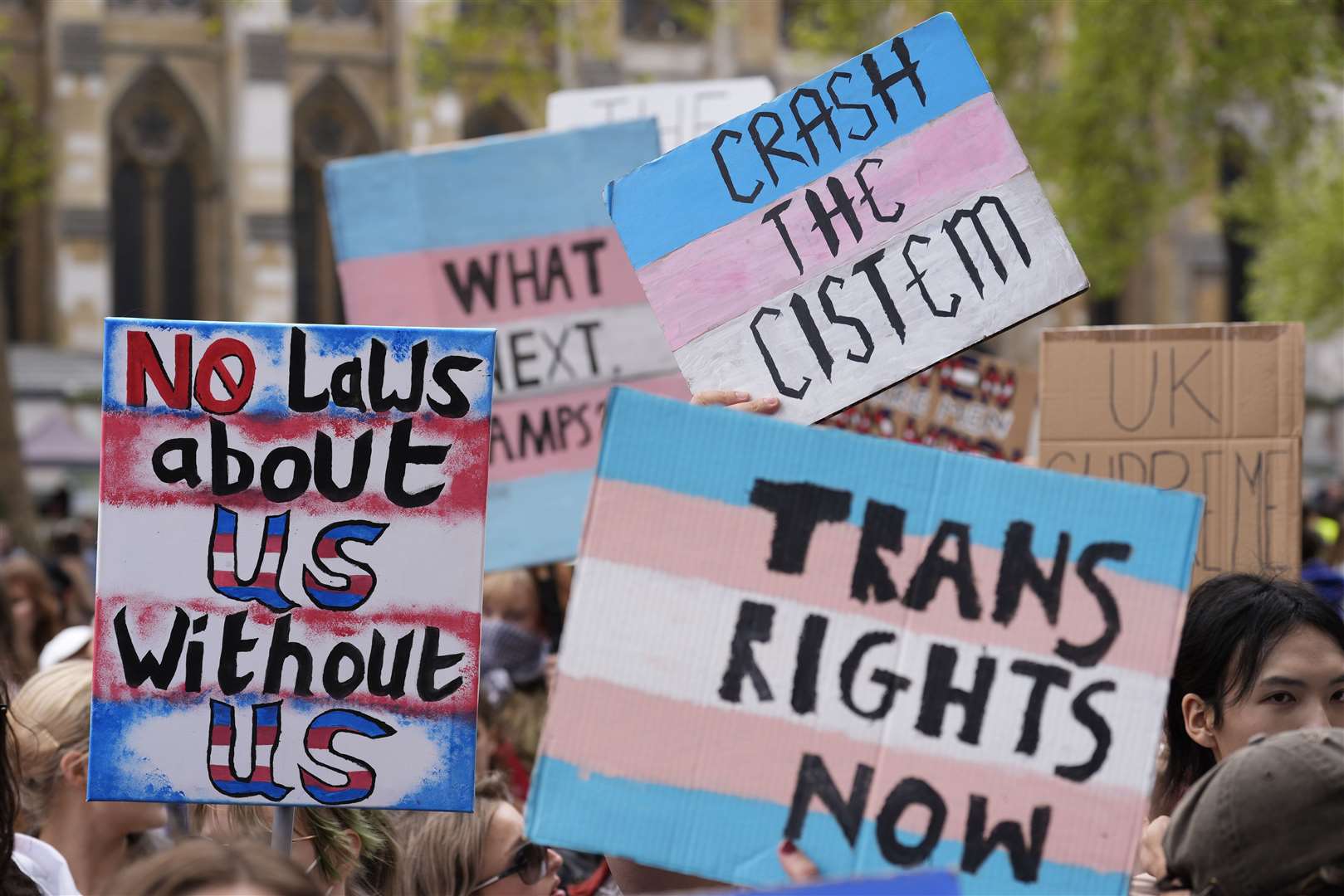 Campaigners take part in a rally organised by trans rights groups, trade unions, and community organisations at Parliament Square in central London, on Saturday (Andrew Matthews/PA)