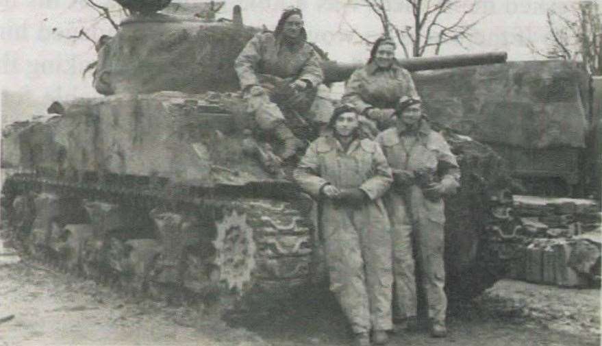 Mr Newton, front left, with his crew and Sherman Tank in Brunssum on the Dutch-German border in November 1944