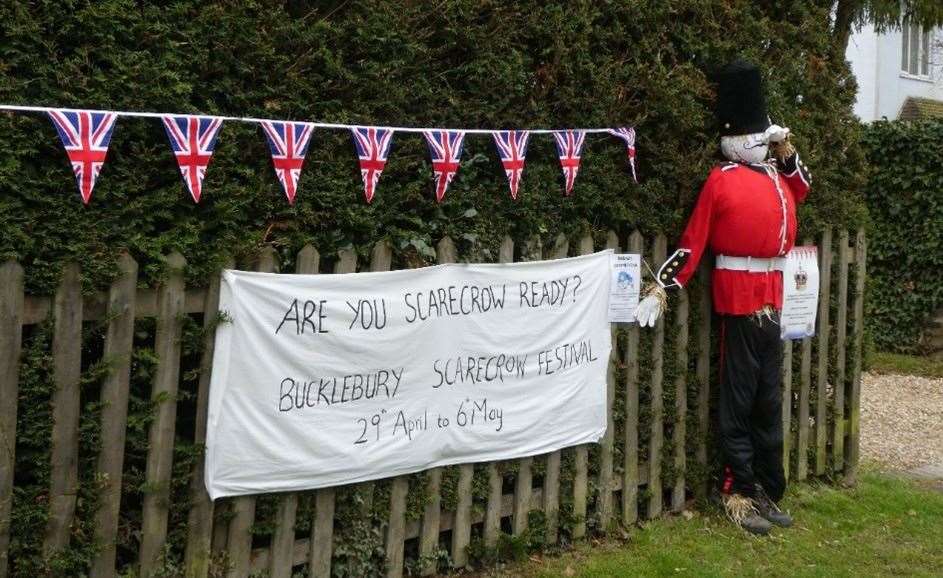 Various handmade royal scarecrows dotted around the village