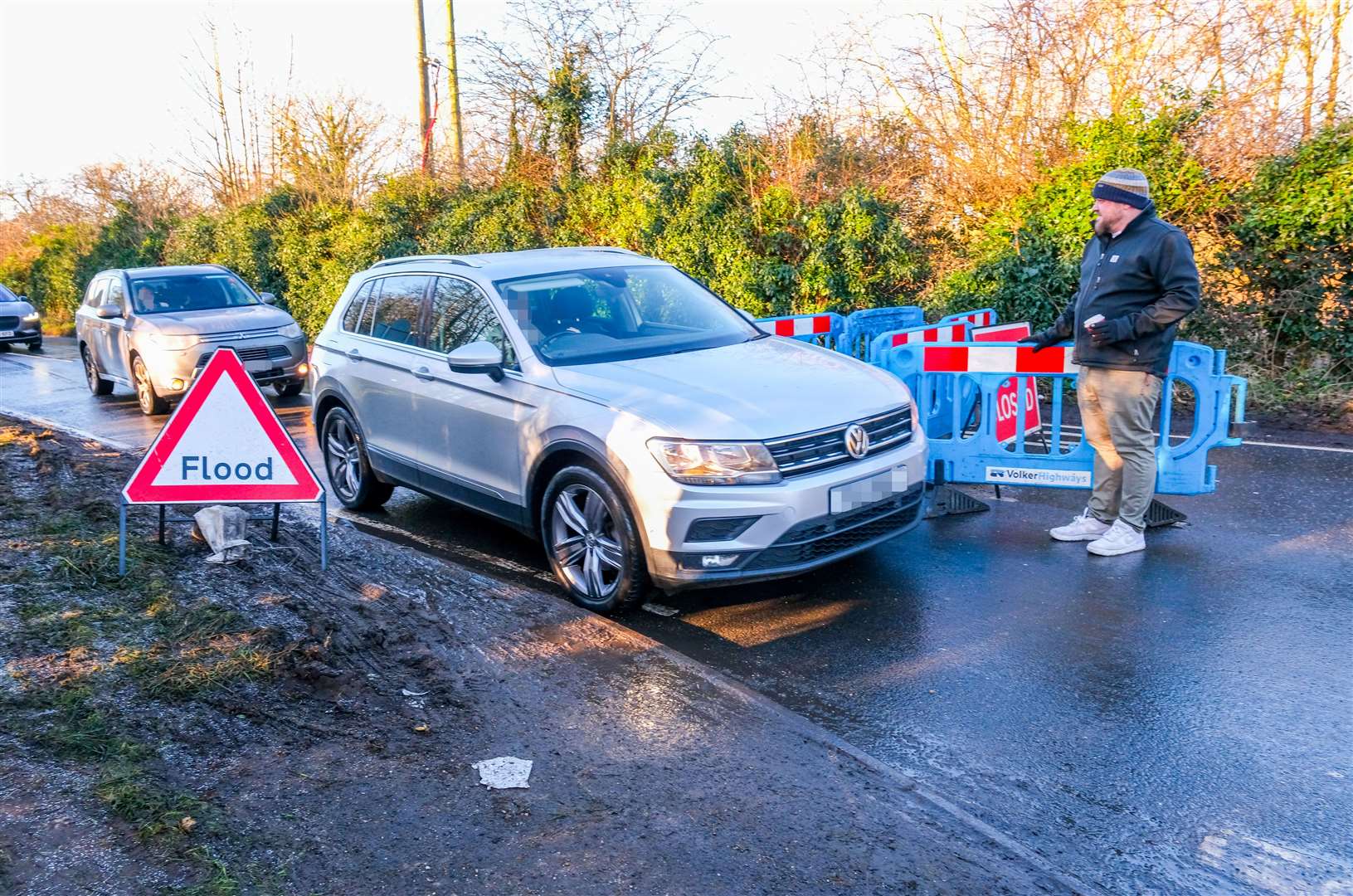 Resident Ben Urbanowicz informing motorists of the closure