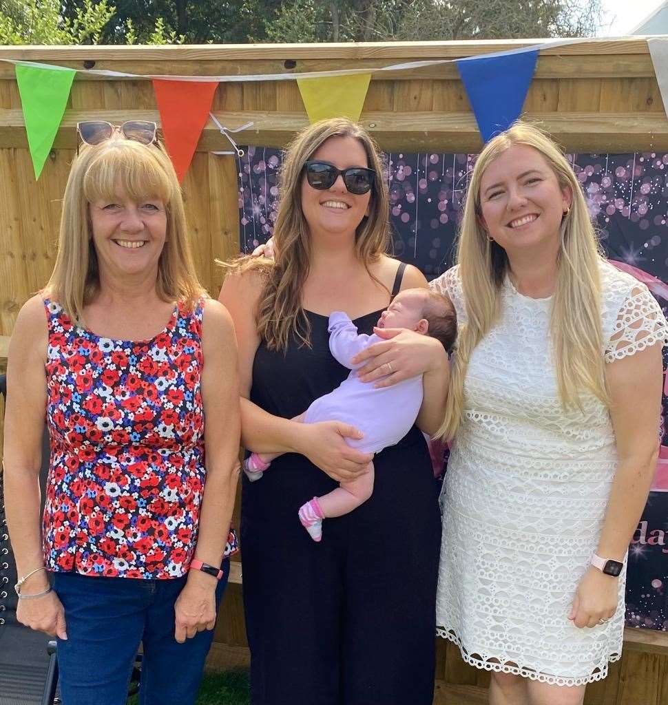 Helen French with her daughters and granddaughter after surgery