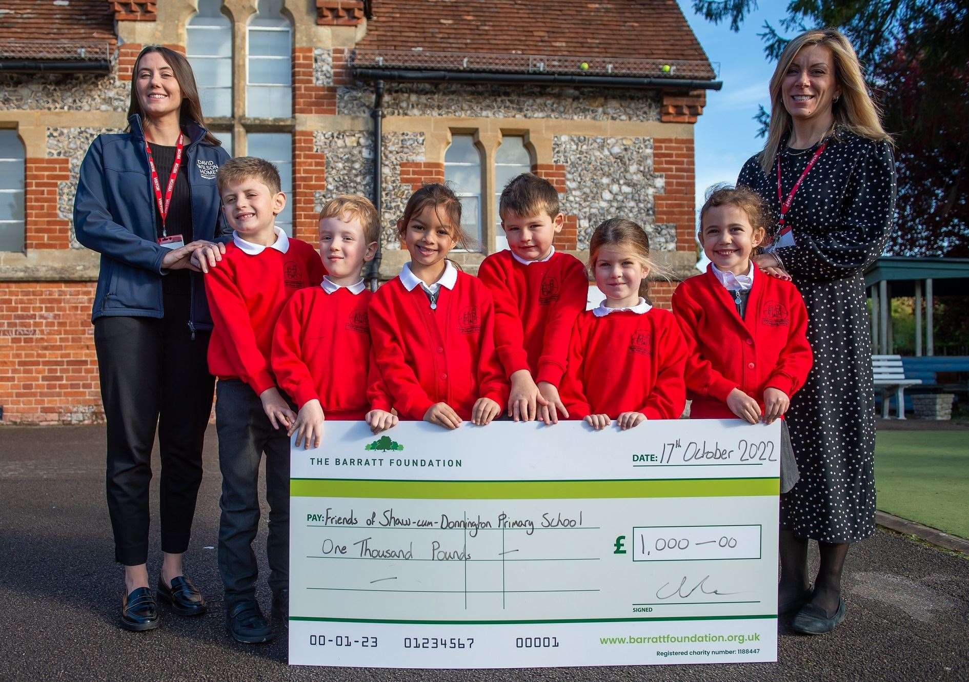Shaw-cum-Donnington Primary School pupils celebrating the donation