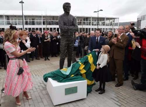 Sir A P McCoy unveils the statue before racing starts on the opening day of the Cheltenham festival