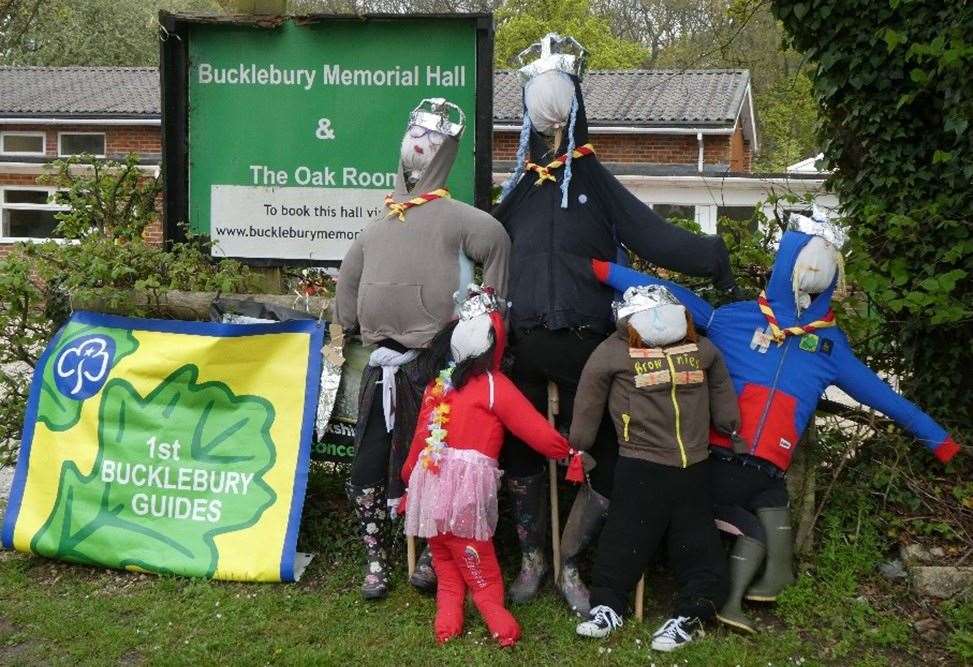 Various handmade royal scarecrows dotted around the village