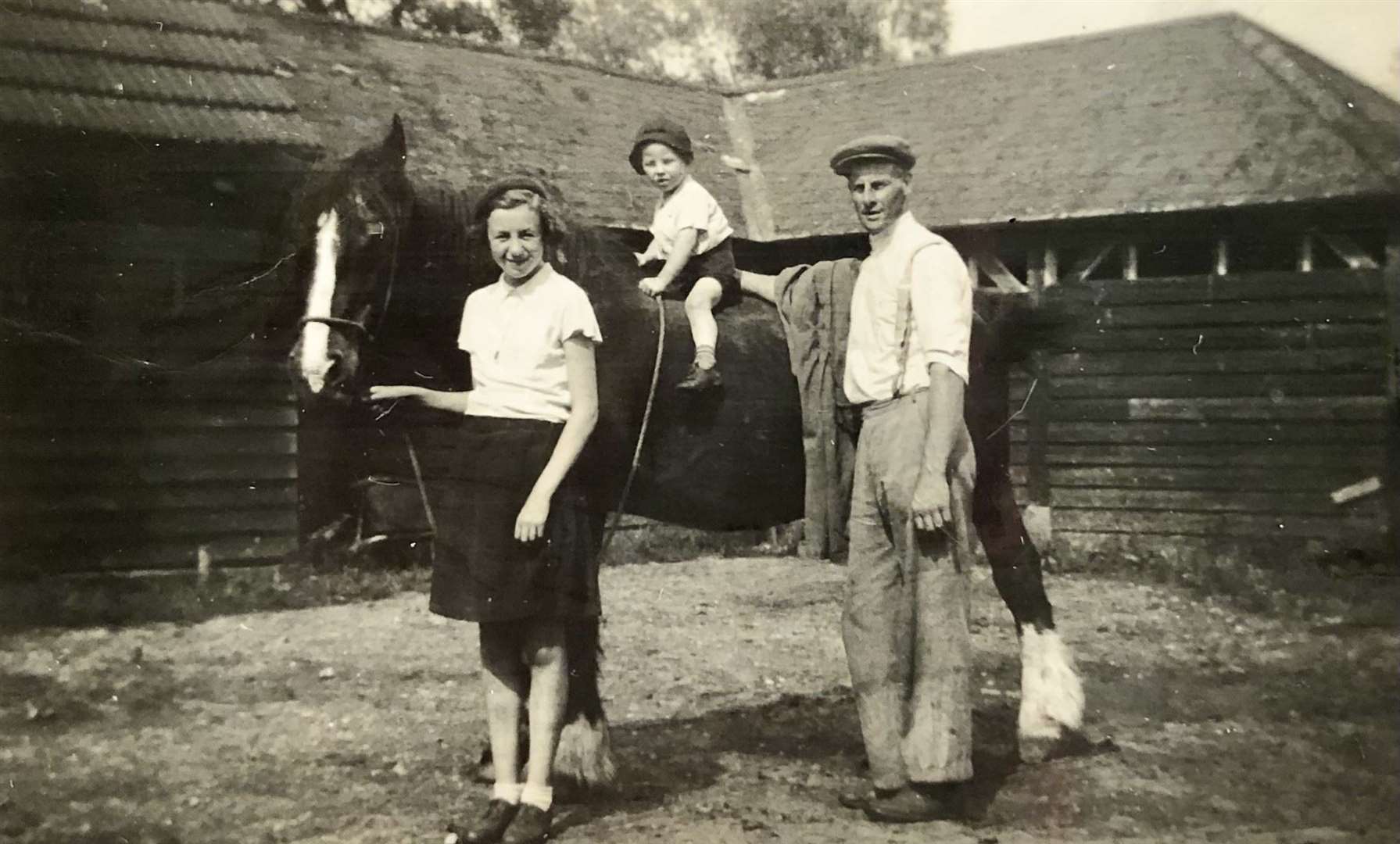 Three-year-old John Grover with his father Richard Grover at Rainsford Farm in 1939