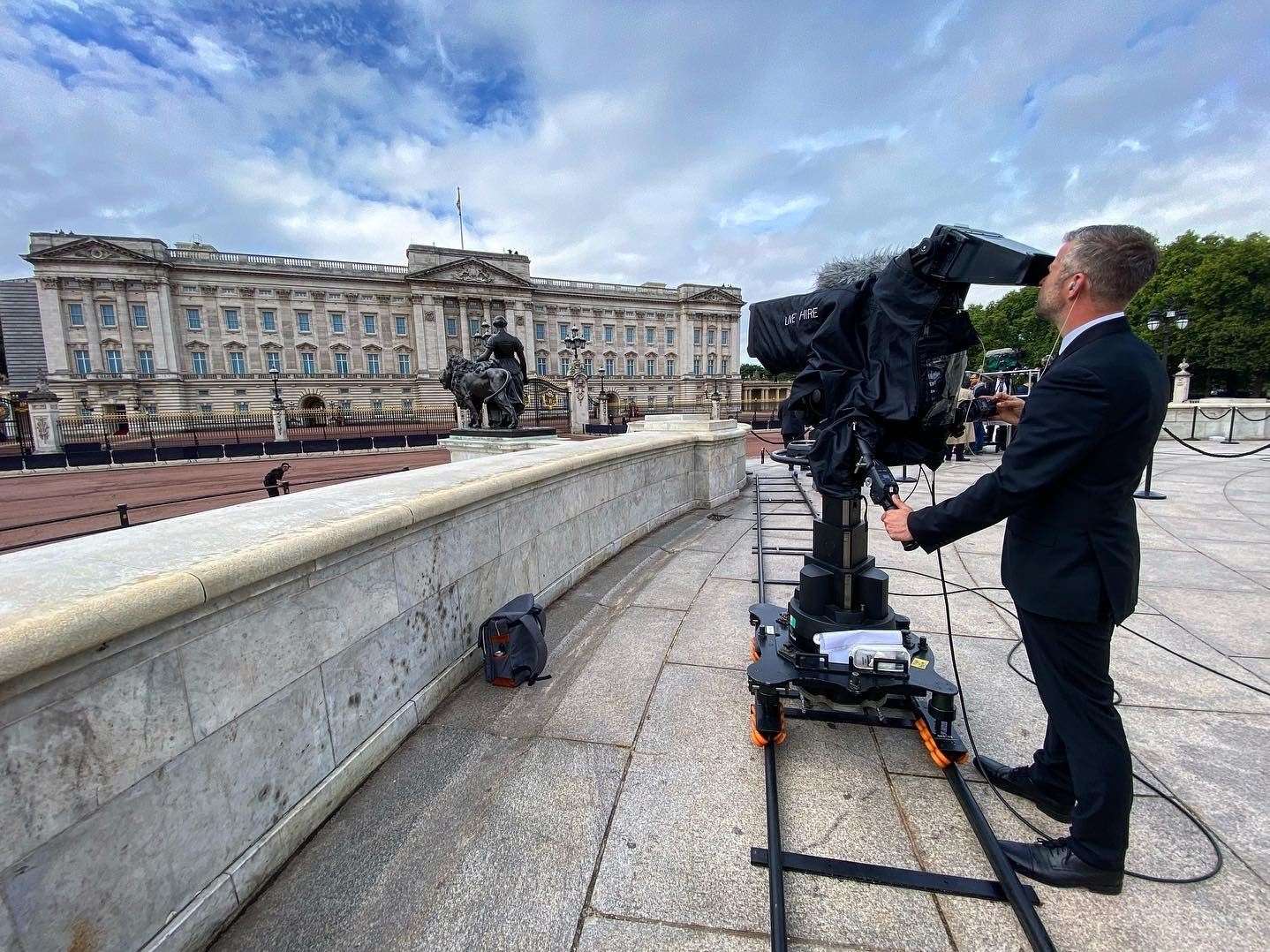 Cameraman James Neal outside Buckingham Palace