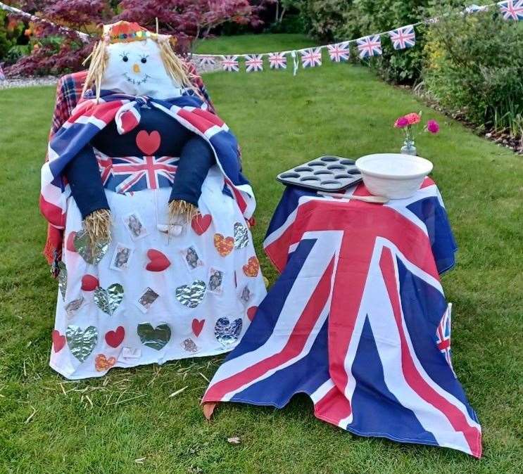 Various handmade royal scarecrows dotted around the village
