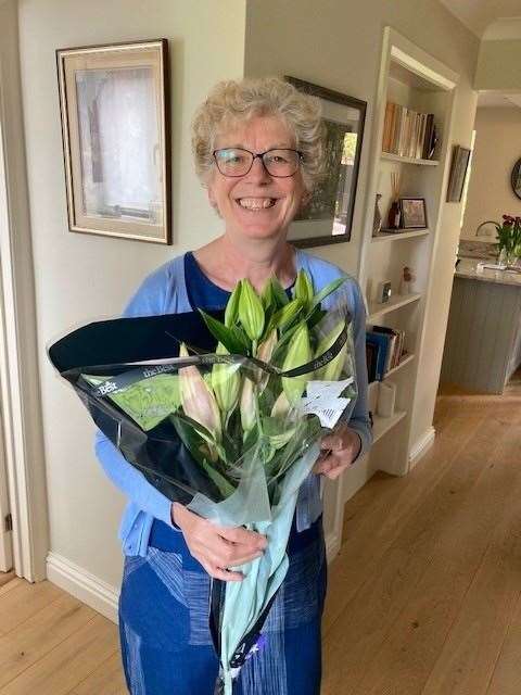 Mrs L was given a bouquet of flowers