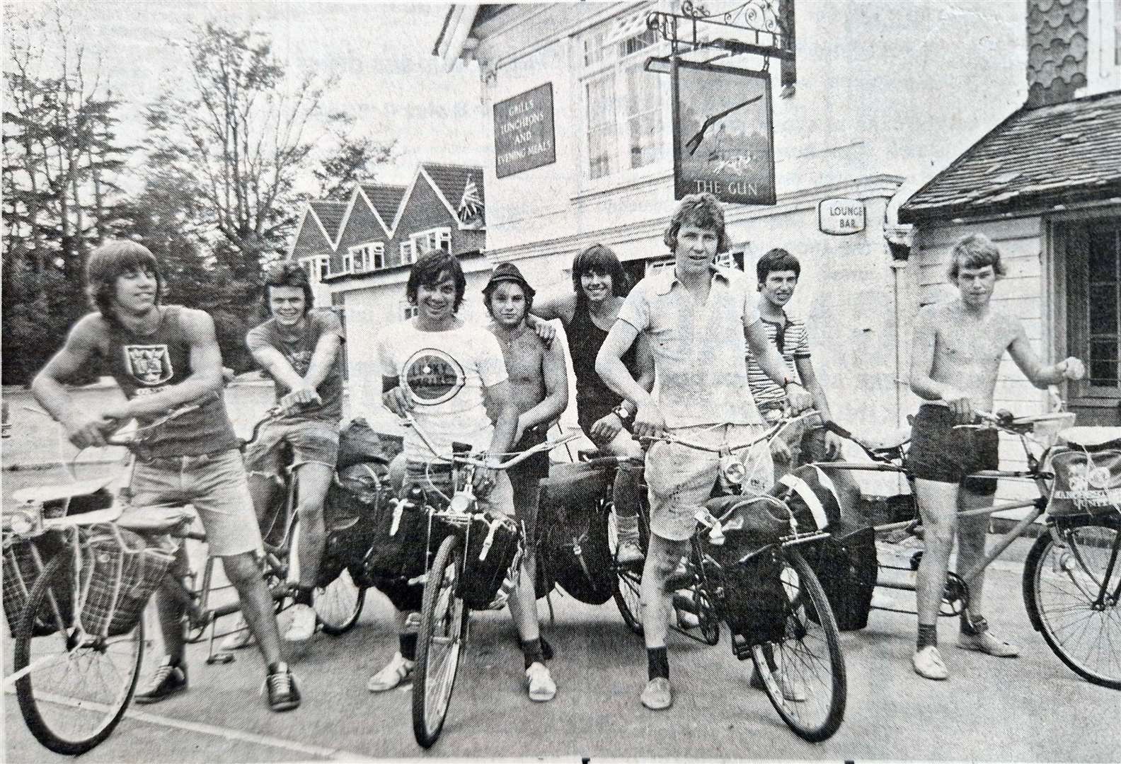 Eight lads on tandems stopped off for a drink at The Gun public house in Newbury after a thirsty ride from Oxford in 1975. Next stop was Andover and then Southampton where the lads – all Venture Scouts from the 22nd Oxford unit – caught the ferry to Cherbourg. The lads, aged 16 to 18, were planning to cover 400 miles in Brittany and their bikes were loaded with camping gear. One of the tandems was hand-made out of two cycles for the holiday.