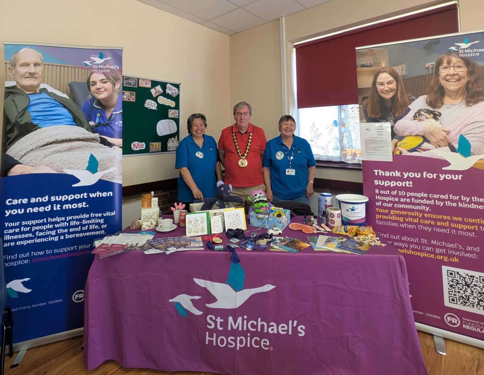 The St Michael's Hospice showcase, with repair café chair Rosemarie Woo, Mayor of Basingstoke and Deane Colin Phillimore and Rosemary Harle