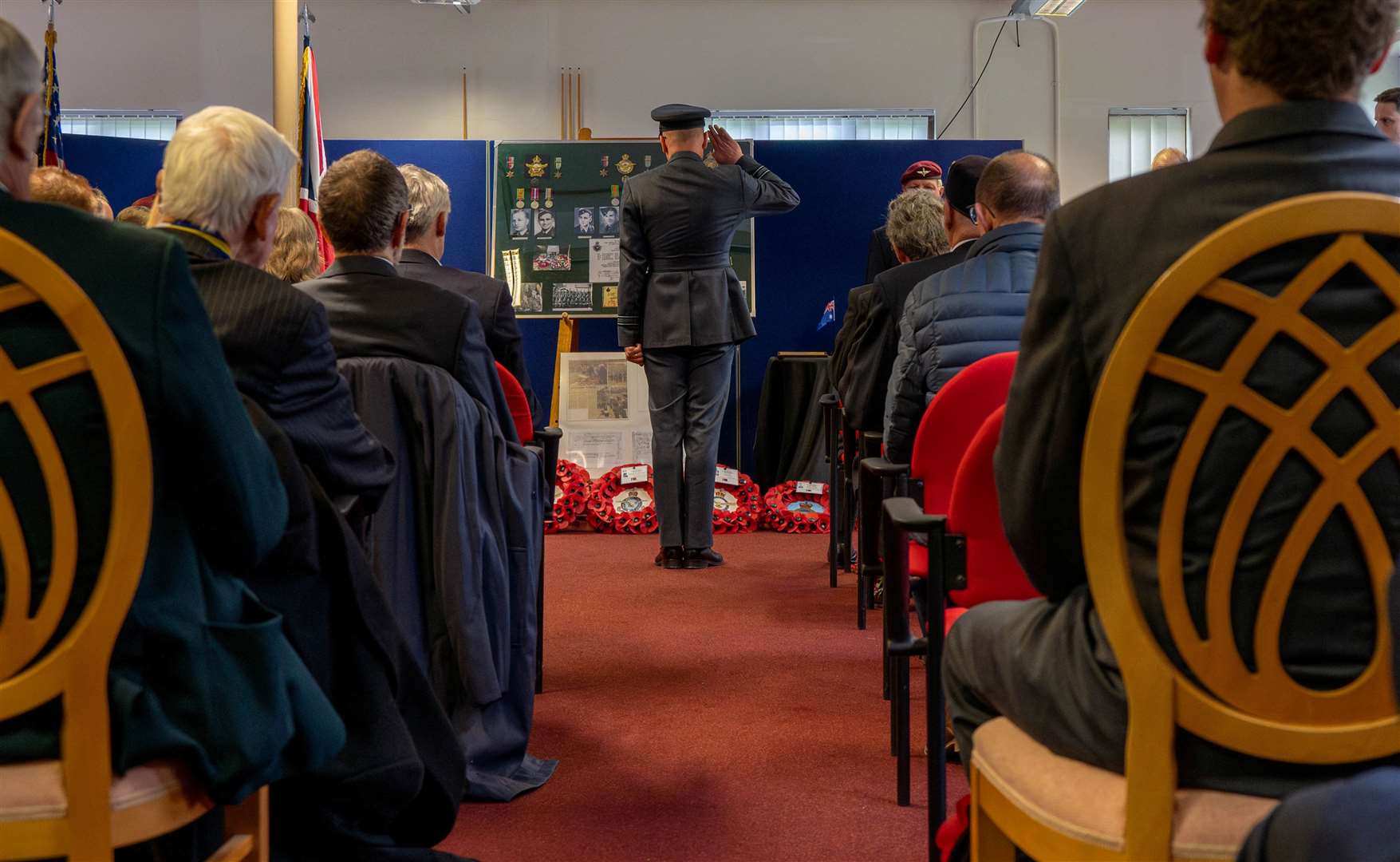 Base commander Major Preston Smith paying his respects during the service. Credit: USAF Staff Sgt Jessica Avallone