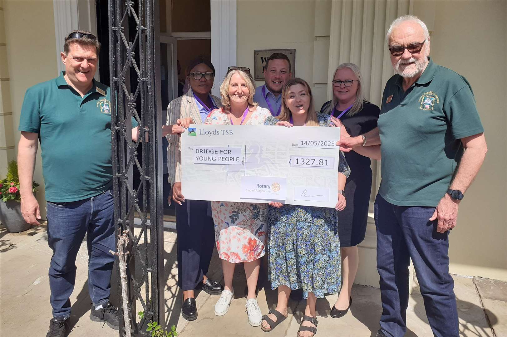 Rotarians Brian Davies and Mal Sandham presenting Art Exhibition cheque to Tracy Underwood, CEO Bridge for Young People