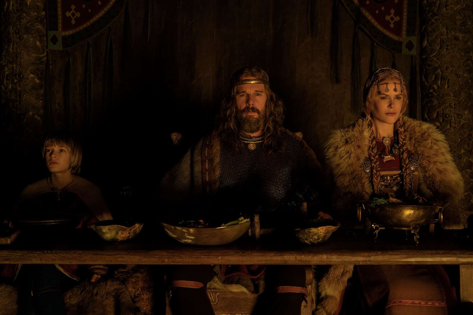 Oscar Novak as Young Amleth, Ethan Hawke as King Aurvandil and Nicole Kidman as Queen Gudrún Credit: Aidan Monaghan / © 2022 Focus Features, LLC (56083198)