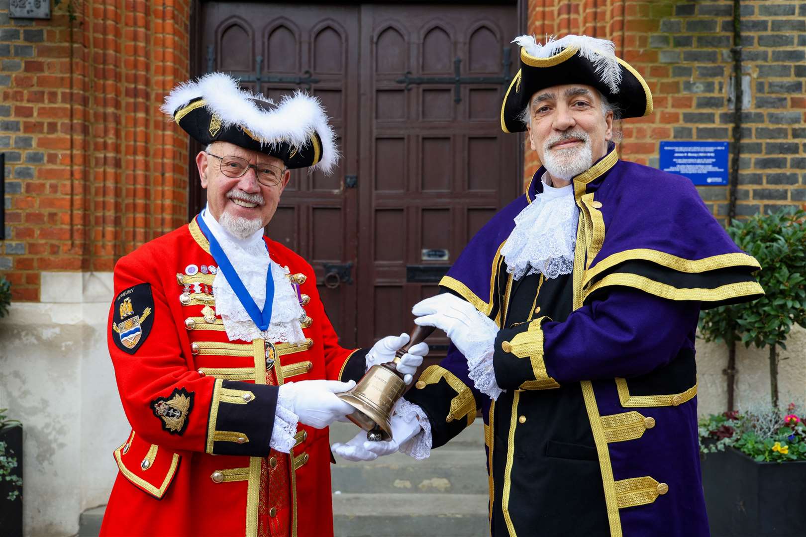 Brian Sylvester handing over the role of Newbury Town Crier to Steve Wallis