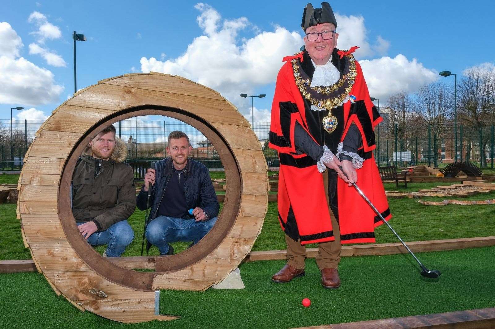 Mayor of Newbury Billy Drummond on the 17th hole with Newbury Adventure Golf directors Jack Robinson (right) and Christopher Aubrey