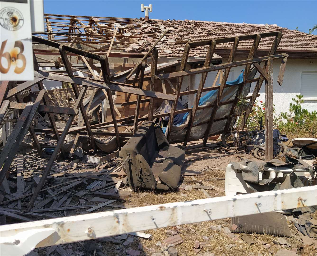 A neighbour's house destroyed in an air raid. The occupants were not at home at the time. Credit: Miriam Kalson