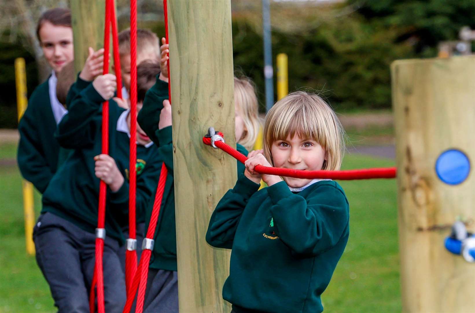 Pupils trying out the new play equipment