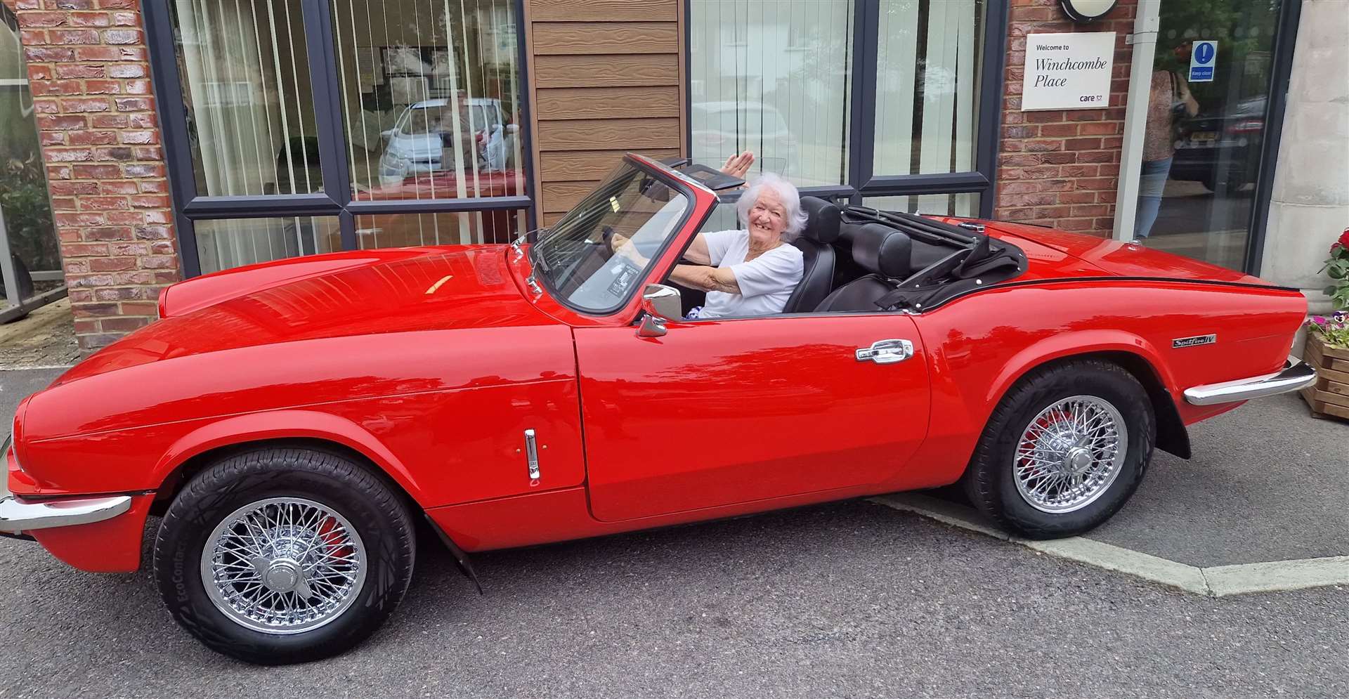 Patricia Steven riding in a sports car for the first time in decades. Credit: Winchcombe Place