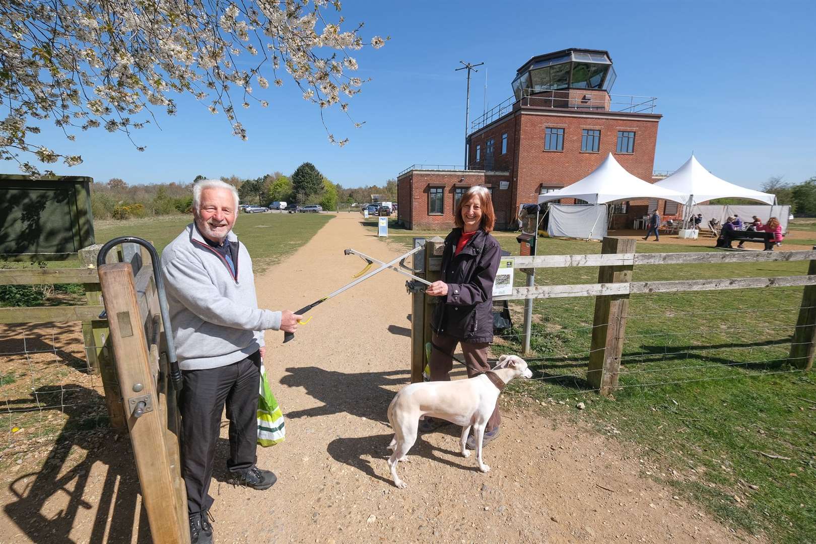 Linda and Cliff Waller picking up the dog poo bags on Greenham Common