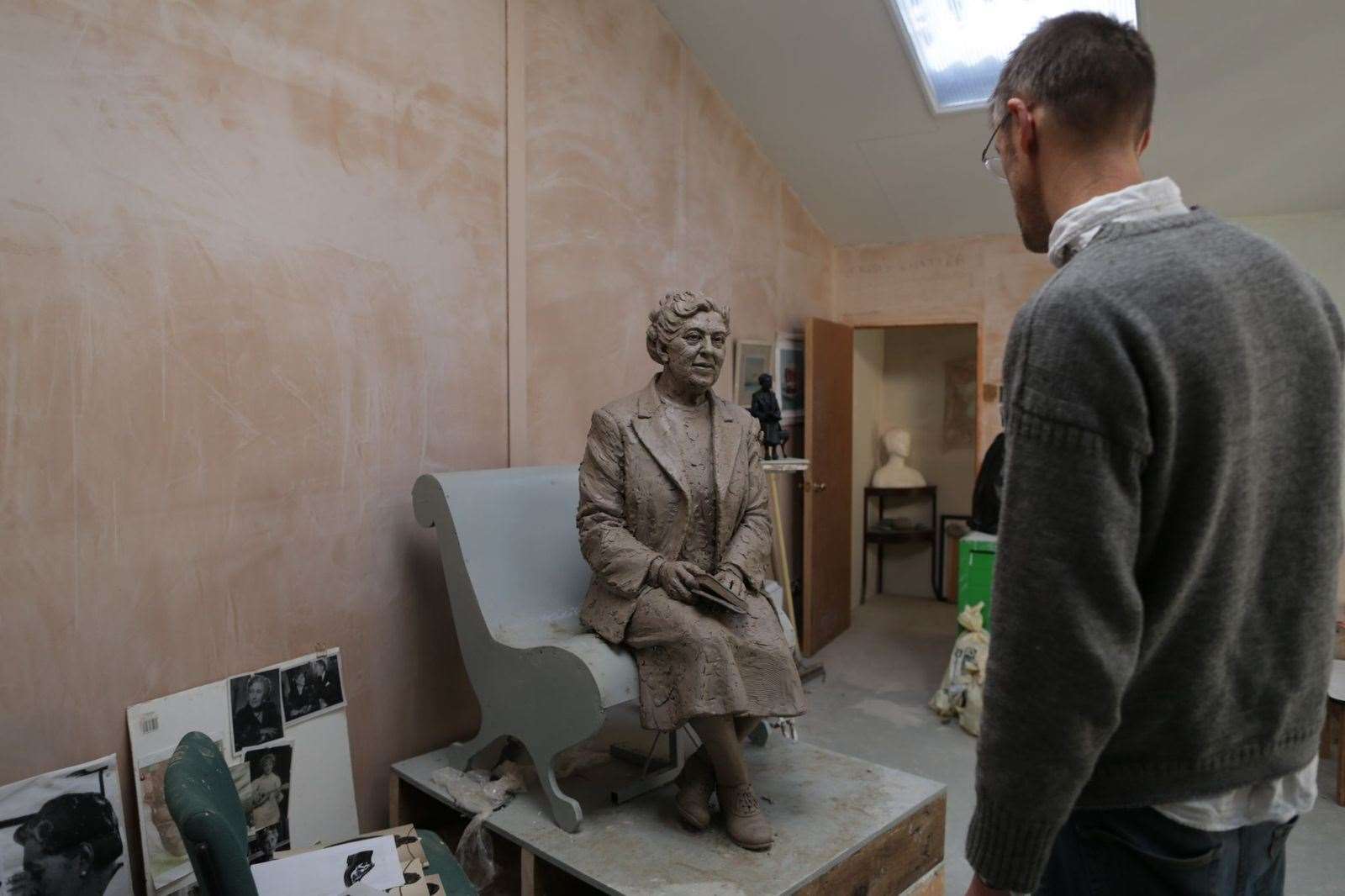 Figurative sculptor Ben Twiston-Davies working on the statue