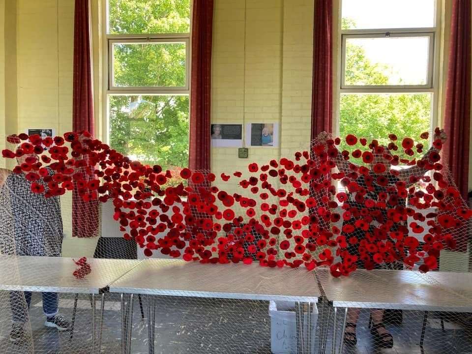Volunteers preparing the poppy net