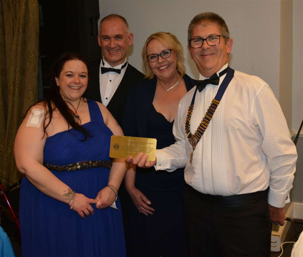 President John with plaque given to EBRT members Claire Fogarty, John Simpson and Loz Wooldridge