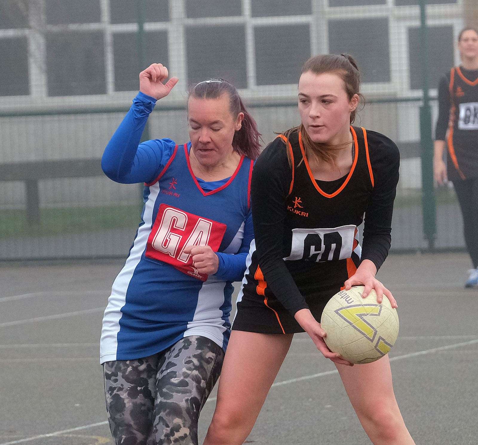 Two players fight for the ball